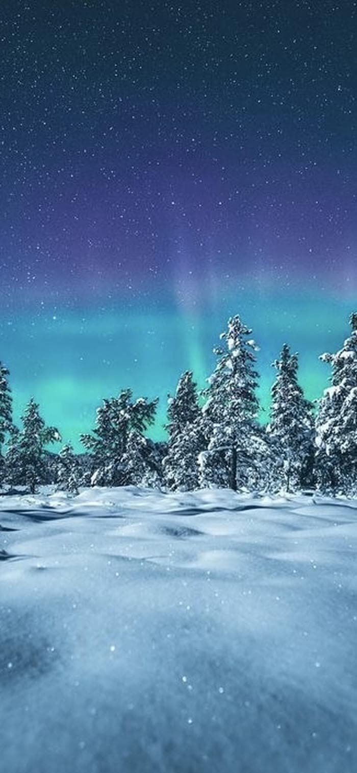 nền đồi tuyết trắng với nền trời cực quang